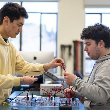 2 physics students working in the lab