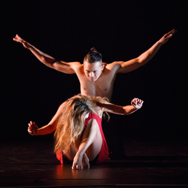 Male Dancer hovering over female dancer.